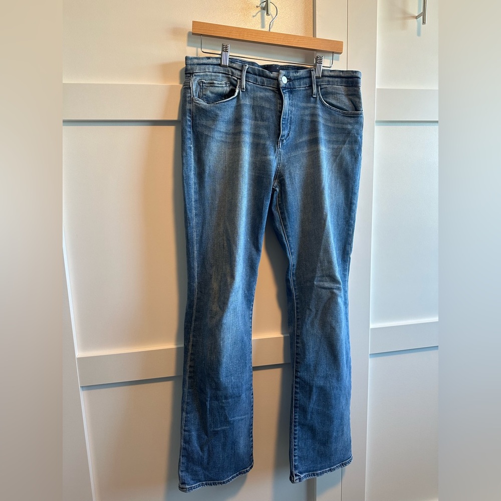 Joe’s jeans distressed The Provacateur petite bootcut jeans.